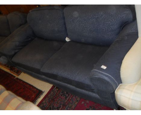 A two seater and a three seater sofa in blue self-patterned upholstery on turned supports to brass castors   CONDITION REPORT