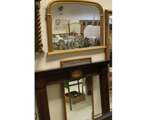 A 20th Century mahogany and inlaid fire surround, a 20th Century gilt framed arch top overmantle mirror, together with a furt