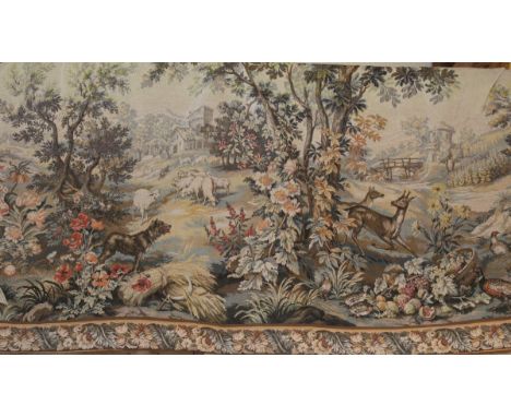 A large Belgian tapestry depicting landscape with animals including dogs, pheasants, deer etc in the foreground, flowers, tre
