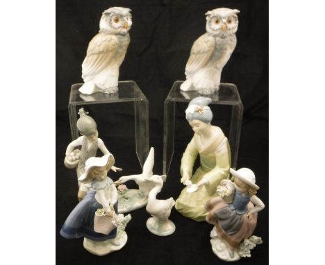 A collection of four Lladro figures including "Girl being chased by goose", "Girl with basket of flowers", another similar an