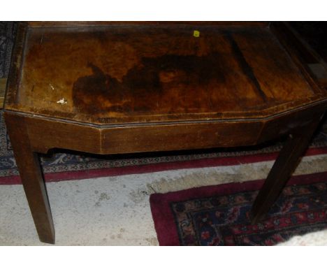 A TV table in the manner of Gordon Russell, a mahogany red leather topped coffee table, two two tier tripod tables and an oct