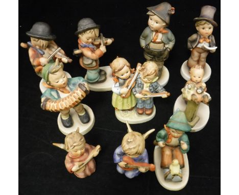 A collection of Goebel Hummel musical figures including "Bird Duet", "Accordion Boy", "Angel  Serenade", "Happy Days" and six