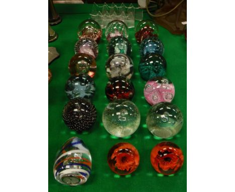 A collection of glass paperweights to include fifteen Caithness "Clock to celebrate the Millenium Year 2000", "Red Poppy" x 2