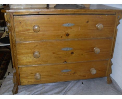 A pine three drawer commode, a 19th Century single door pot cupboard to plinth base, a 20th Century pine pot cupboard, three 