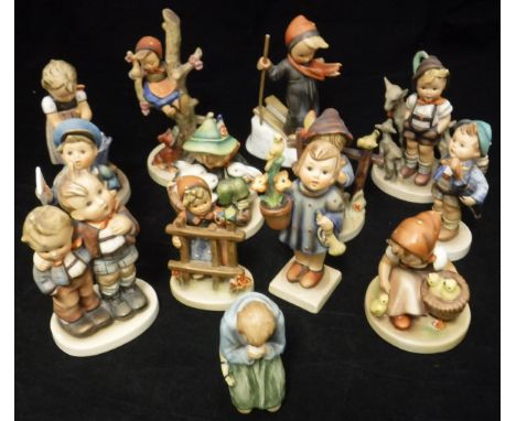 A collection of Goebel Hummel figures including: "She loves me she loves me not", "Playmates", "Baking Day", "Out of Danger",