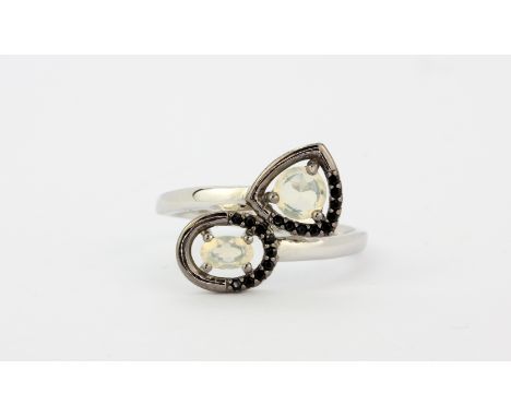 A 925 silver crossover ring set with opals and black spinels, (R).