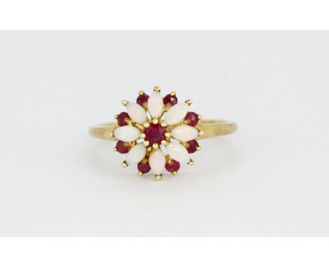 A 9ct yellow gold opal and ruby set cluster ring, (N.5).