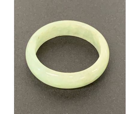 A fine Chinese pale green jade wedding ring, W. 5.5mm ring size - U.