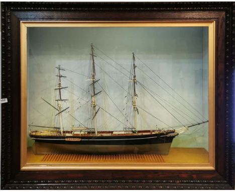 A very impressive cased oak framed model of the Cutty Sark, scratch built in wood, frame size 123cm x 99cm x 44cm, with inter