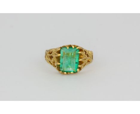 A yellow metal (tested high carat gold) ring set with an emerald cut Columbian emerald, with a GCS certificate, (O).