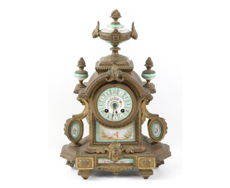 Late 19th/ early 20th century French gilt metal mantel clock the two train movement with painted porcelain dial over panels o