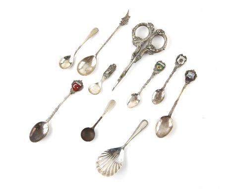 Shell bowl silver caddy spoon, a selection of continental silver spoons in various grades and a pair of silver handled scisso
