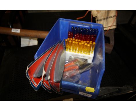 A box containing a small quantity of tools including pliers, three scythe stones and an assorted set of Draper miniature scre