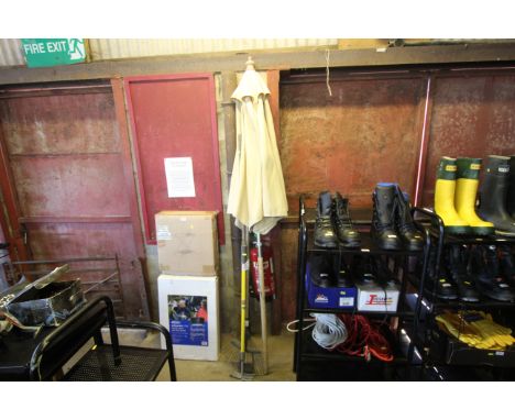A garden parasol and a quantity of garden tools included a rake, hoe etc