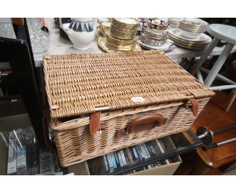 A wicker picnic hamper 