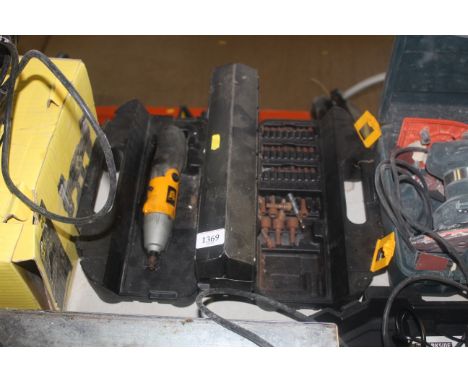A JCB cordless electric screwdriver with various screw bit attachments in fitted plastic case (lacking charger)