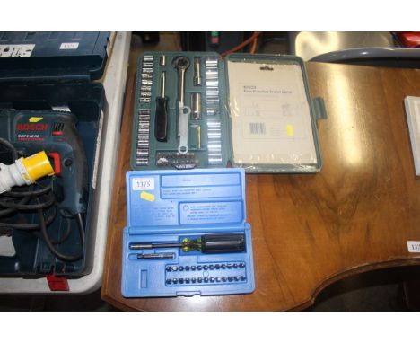 A socket set in fitted plastic case and a screwdriver set in plastic case