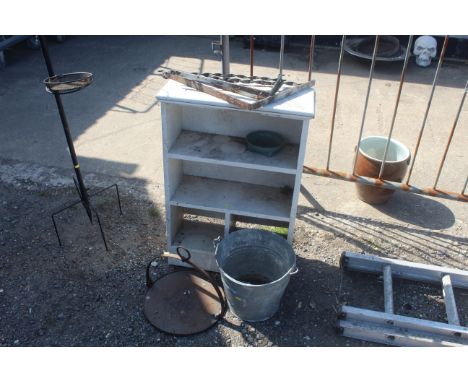 Three various wall brackets, a galvanised pail with swing handle, metal hanging skillet and small wooden bookcase