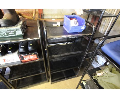 Two four tier metal shelf units