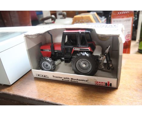 An Ertl model of a Case International tractor in box