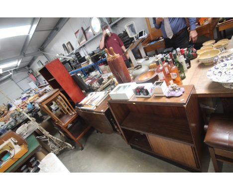 A teak open fronted bookcase, an oak gate leg dining table, a nest of walnut coffee tables, a laminate open fronted bookcase 