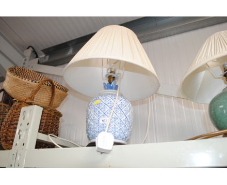 A blue and white pottery pineapple shaped table lamp and shade