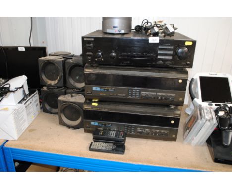A Kenwood KA-3080R stereo integrated amplifier, two Technics SL-MC7 compact disc changers and a set of nine Wharfedale speake