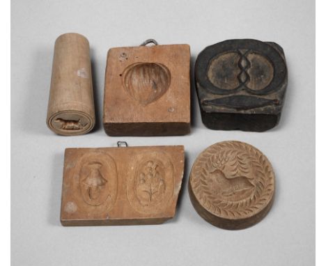 Fünf Model19. Jh., Laubholz beschnitzt, teils dunkel gefasst, unterschiedlich große Gebäckmodel, mit Darstellungen aus Flora 