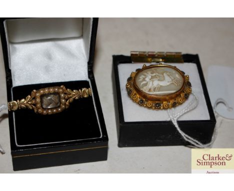 A yellow metal and seed pearl set bar brooch; and a cameo brooch