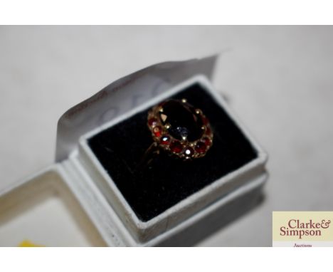 An antique 9ct gold garnet set ring 