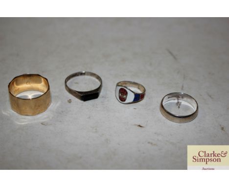 A 9ct gold ring 4.5gms; a 9ct white gold ring 2gms; and two silver rings 