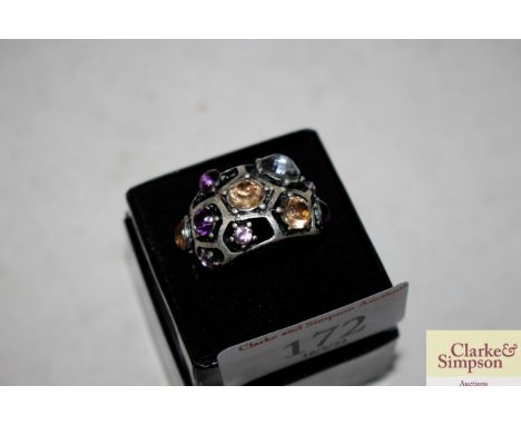 A boxed large multicoloured costume ring 