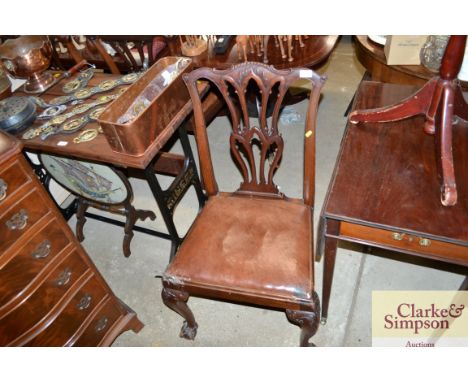 A set of four carved mahogany Chippendale style dining chairs