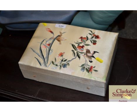An Oriental silk covered trinket box 