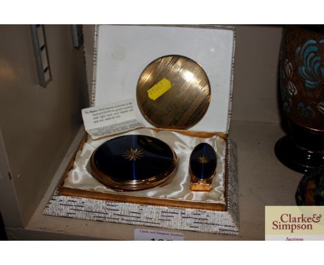 A yellow metal compact; a Stratton cased compact and mirror