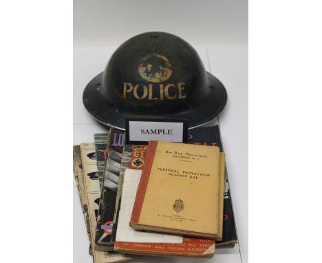 Collection of Second World War related items including Police tin helmet, goggles, official booklets and gas mask