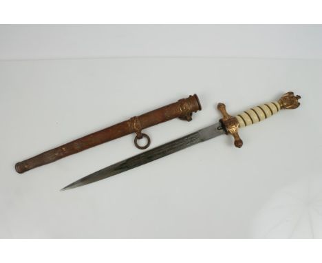 Nazi Naval Officers' dagger with gilt brass fittings and ivorine grip, etched blade by Eikhorn, in original scabbard with lig