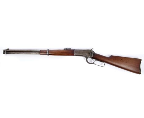 Deactivated Model 1892 44-40 WCF Winchester under-lever action saddle carbine with round barrel with part remaining address a