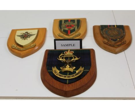 Collection of Elizabeth II British Army Regimental crests and insignia, including Royal Anglian Regiment and Gordon Highlande