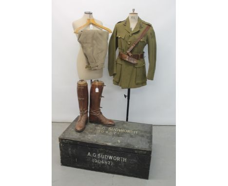 First World War Royal Artillery Lieutenants' Service dress jacket with Sam Browne belt and boots, together with a tin militar