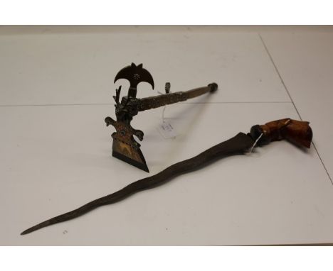 19th century Indonesian kris with watered blade and brass ceremonial axe set with cabochon red, orange and blue stones decora