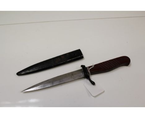 First World War Imperial German trench knife with wooden grips, clipped spear-pointed blade, in original black painted sheath