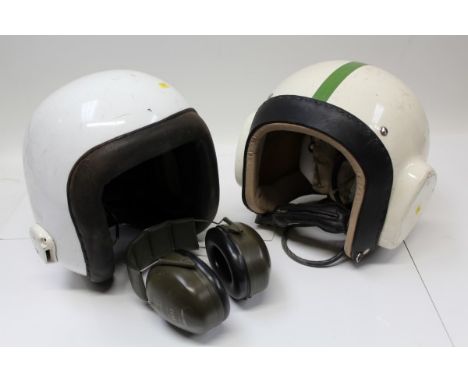 Contemporary R.A.F. flying helmet, with integral earphones, white painted outer with green stripe, together with another simi