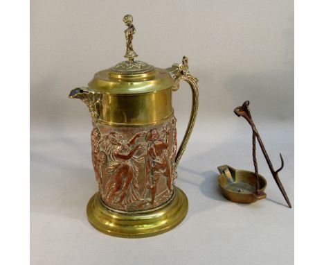 A VICTORIAN COPPER AND BRASS CAST FLAGON WTH EMBOSSED FIGURES IN RELIEF, A BACCHUS SPOUT AND HINGED COVER WITH BOY FINIAL, BY