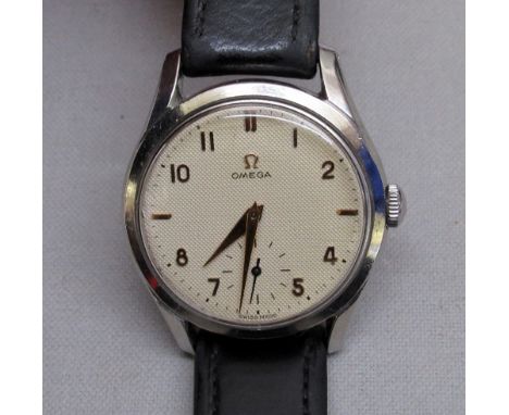 A 1950's OMEGA GENTLEMAN'S STAINLESS STEEL MANUAL WIND WRISTWATCH WITH SECONDS DIAL