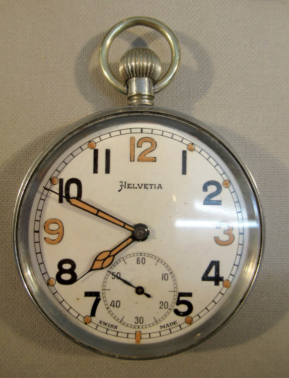 A MILITARY POCKET WATCH THE CIRCULAR WHITE DIAL INSCRIBED  