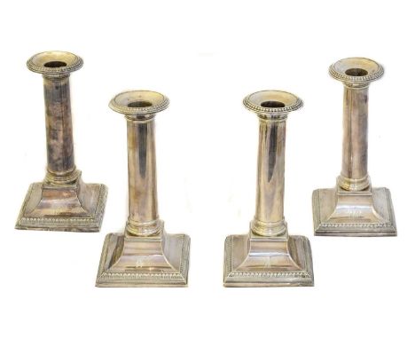 Four George III silver candlesticks,  Four George III silver candlesticks, Tudor & Leader, Sheffield, 1789, height 18.5cm (4)