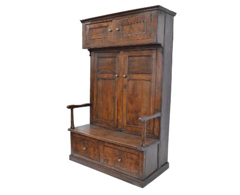 George III Burr Elm West Country Bacon Settle George III burr elm and oak West Country Bacon settle, moulded cornice above a 