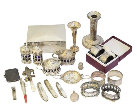 A selection of silver, A selection of silver, to include a blue glass lined cruet set, rattles, napkin rings, cigarette box, 