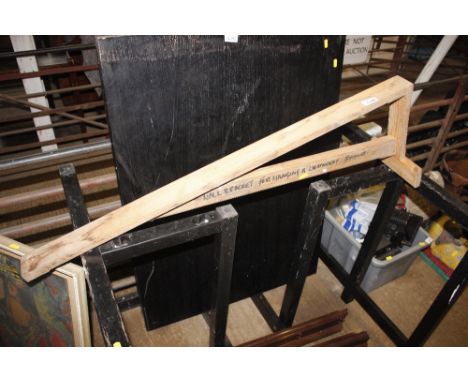 A wooden wall bracket for hanging a lightweight bicycle 
